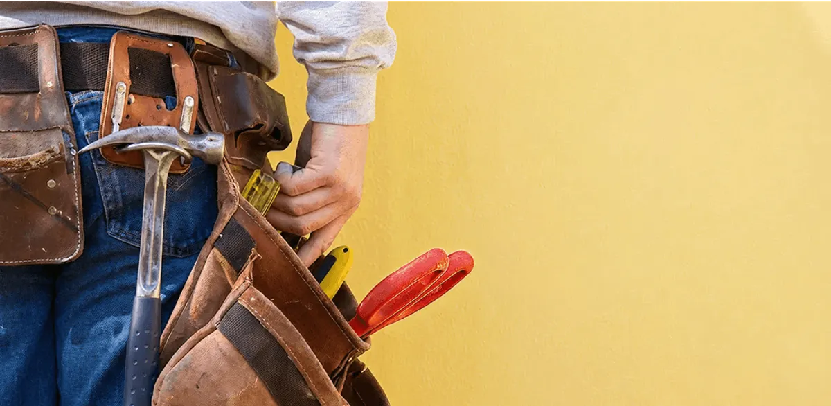 Handyman with tool belt ready for home repairs and maintenance in Henderson, NV