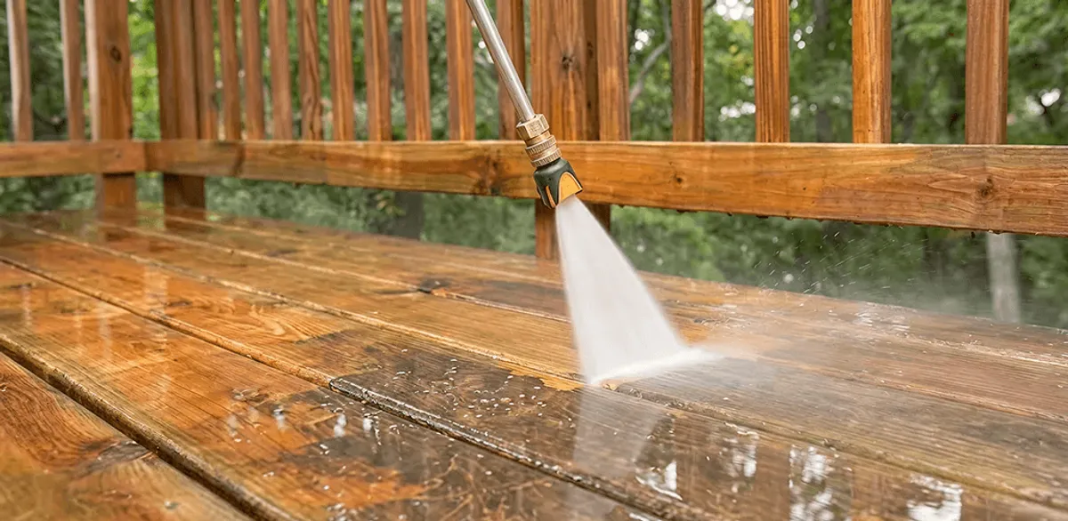 Pressure washing a wood deck to remove dirt and buildup in Henderson, NV